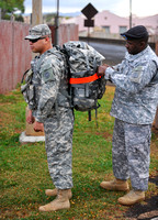 1SG Williams preps SPC Rodriguez for the ruck march